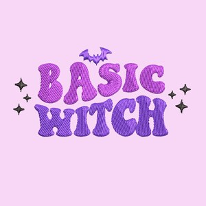 May include: Purple and pink embroidered text that reads "Basic Witch" with a small black bat above the word "Basic". There are small black stars on either side of the text.
