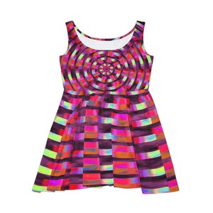 May include: A sleeveless dress with a colorful geometric pattern. The dress has a fitted bodice and a flared skirt. The pattern is a combination of circles and stripes in shades of pink, red, orange, yellow, and green.