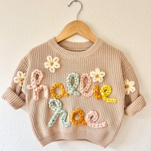 Baby Name Sweater—12 letters max (plus 4 small designs)