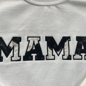 MAMA Cow print applique crewneck