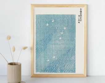 May include: A framed print of a blue and white Japanese woodblock print depicting a flock of birds flying over a field of water. The print is titled "The Birds of the Water" in Japanese.