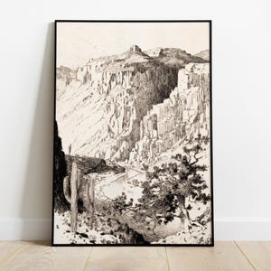 Puede incluir: Ilustración en blanco y negro de un paisaje desértico con un cactus alto en primer plano y un río serpenteando por el cañón en el fondo.