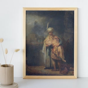 May include: A framed oil painting depicting two men in a dark setting. The man on the left is wearing a turban and a long robe. The man on the right is wearing a shorter robe and holding a sword. The painting is set against a backdrop of a building and trees.