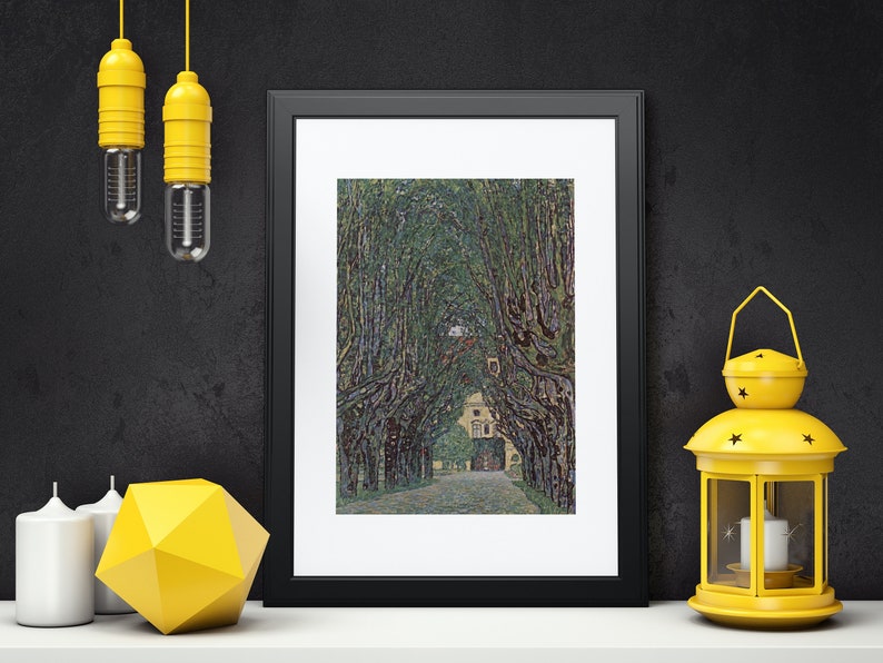 May include: A framed print of a painting depicting a tree-lined path leading to a building. The trees are green and the path is light gray. The building is white with a brown roof.