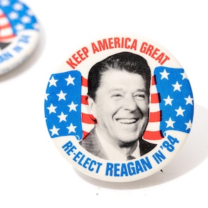 May include: A trio of ceramic mugs with a speckled, matte finish in cream, light grey, and dark grey. Each mug features a simple, minimalist design, ideal for tea or coffee.