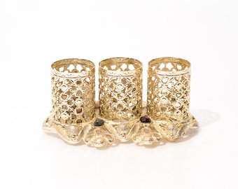 Porta rossetto vintage, in metallo traforato con strass.