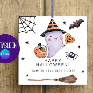 May include: A printable Halloween card featuring a purple ghost wearing a black and orange witch hat, holding a heart-shaped cookie. The ghost is flying on a broomstick with a spider and bat in the background. The text on the card reads "Happy Halloween! From: The Sanderson Sisters."