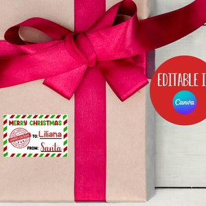 May include: A brown gift box with a red ribbon and a red and green striped gift tag that says "Merry Christmas" with a red stamp that says "Santa's Workshop" and the text "To: Liliana From: Santa". The image also includes a red circle with the text "Editable in Canva".