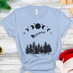 Flying Reindeer Christmas T-Shirt, Moon Phases Shirt, Santas Sleigh X-Mas Tee, Unisex Christmas Shirt, Celestial T-Shirt, X-Mas Shirt