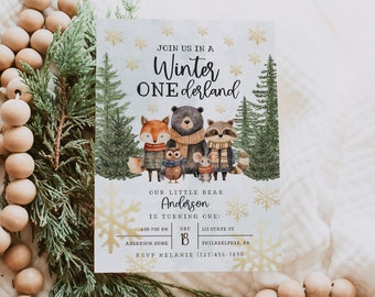 May include: A winter wonderland themed first birthday party invitation with a watercolor illustration of a bear, fox, raccoon, owl, and mouse. The invitation features the text "Join us in a Winter One derland" and "Our little bear Anderson is turning one!" with details for the party including the date, time, and location.