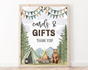 May include: A printable sign with a watercolor illustration of a campfire, tent, and bear in a forest setting. The sign says "cards & gifts thank you!" and is perfect for a rustic wedding or party.