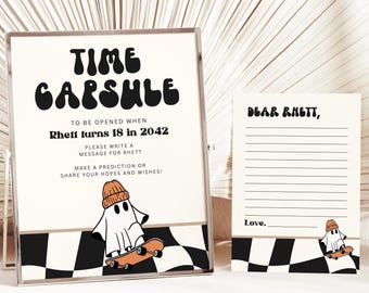 May include: A white and black checkered background with a ghost wearing a beanie and riding a skateboard. The text reads "Time Capsule" and "To be opened when Rhett turns 18 in 2042". A separate card reads "Dear Rhett," with lines for writing and the text "Love,".