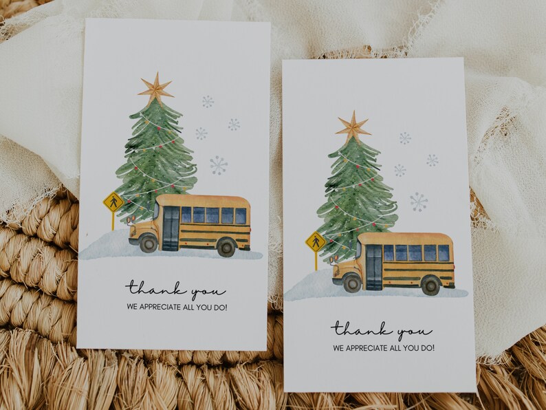 May include: Two thank you cards with a watercolor illustration of a yellow school bus driving past a decorated Christmas tree. The text on the cards reads "thank you, we appreciate all you do!"