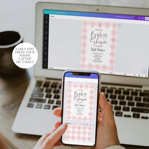 May include: A laptop computer displaying a pink and white gingham baby shower invitation on the screen. A person is holding a smartphone displaying the same invitation. The text on the invitation reads "Come join us for a Baby Shower in honor of Katie Hampton".