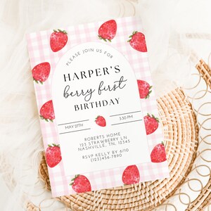 May include: A pink and white gingham patterned invitation with a watercolor illustration of strawberries. The invitation reads "Please join us for Harper's berry first birthday, May 27th, 3:30 PM, Roberts Home, 123 Strawberry Ln, Nashville, TN, 12345, RSVP Kelly by 6/10 (123)456-7890".