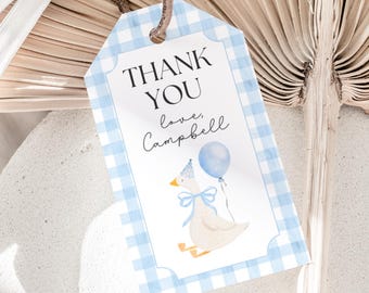 May include: Blue and white gingham thank you tag with a cartoon goose wearing a party hat and holding a blue balloon. The text reads "Thank You love, Campbell".