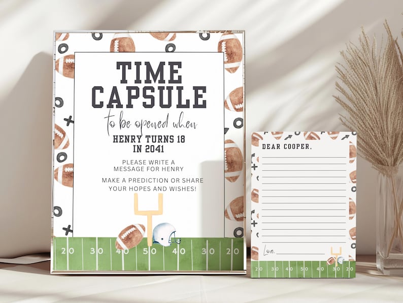 May include: A white card with a green and brown football theme. The card says "Time Capsule to be opened when Henry turns 18 in 2041". There is a smaller white card with lines for writing a message to Henry.
