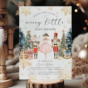May include: A light blue baby shower invitation with a watercolour illustration of a ballerina, a nutcracker, and a mouse. The text reads "Please join us for a merry little baby shower" and includes the name "Clara Nelson", the date "December 19, 2024", the time "2:00 PM", the address "123 Christmas St New York, NY", the RSVP contact "Jessica (123)456-7890", and the registry information "Clara is registered at Amazon".