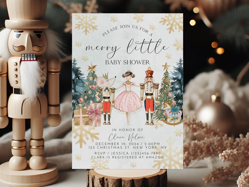 May include: A light blue baby shower invitation with a watercolour illustration of a ballerina, a nutcracker, and a mouse. The text reads "Please join us for a merry little baby shower" and includes the name "Clara Nelson", the date "December 19, 2024", the time "2:00 PM", the address "123 Christmas St New York, NY", the RSVP contact "Jessica (123)456-7890", and the registry information "Clara is registered at Amazon".