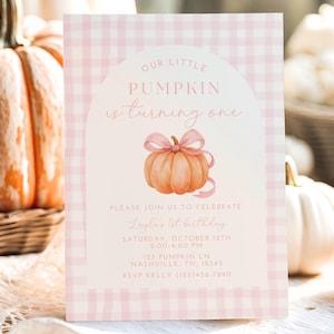 May include: A pink and white gingham-patterned invitation card with the text "Our Little Pumpkin is turning one." A watercolour illustration of a pumpkin with a pink bow is featured. The card includes party details.
