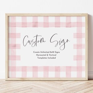 May include: A framed 8x10 inch sign with a pink and white gingham pattern. The text "Custom Sign" is written in black cursive script. The text "Create Unlimited 8x10 Signs Horizontal & Vertical Templates Included" is written in black sans-serif font.