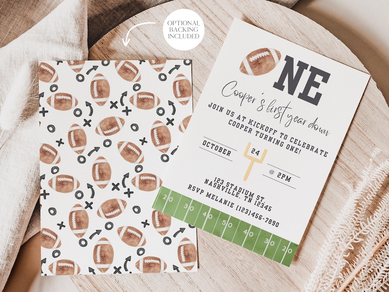 May include: A printable football-themed first birthday party invitation with a green and white football field design. The invitation says "Cooper's first year down" and "Join us at kickoff to celebrate Cooper turning one!" with the date, time, and location.