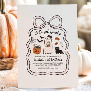 May include: A Halloween-themed invitation with a pink border and bow. The text "Let's get spooky" is at the top. The invitation includes a ghost, black cat, pumpkin, and bats. The invitation is for Hailey's 3rd birthday.