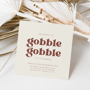 May include: A beige invitation card with brown text that reads "Get ready to gobble gobble 'til ya wobble." The invitation is for a Friendsgiving on Saturday, November 19, 2022, at 6 o'clock in the evening at 123 Gravy St. Nashville, TN.