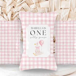 May include: Pink and white gingham favor bags with a white label that says "Isabella is One silly goose" with a cartoon goose wearing a party hat and holding a pink balloon.