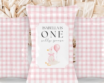 May include: Pink and white gingham favor bags with a white label that says "Isabella is One silly goose" with a cartoon goose wearing a party hat and holding a pink balloon.