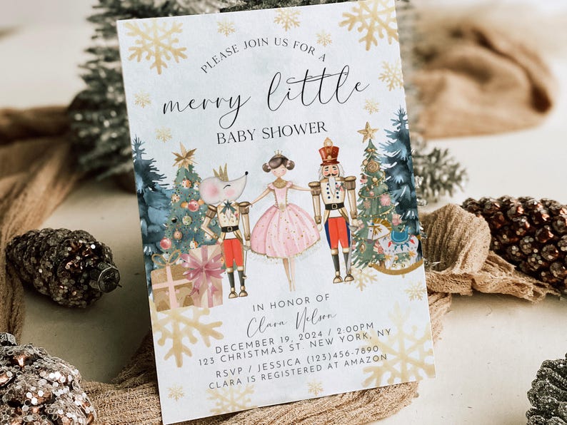 May include: A white invitation card with gold snowflakes and a watercolour illustration of a Nutcracker, a ballerina, and a mouse. The text reads "Please join us for a merry little baby shower in honour of Clara Nelson, December 19, 2024, 2:00 PM, 123 Christmas St, New York, NY, RSVP/Jessica (123) 456-7890, Clara is registered at Amazon."