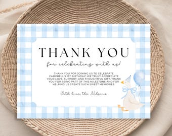 May include: Blue and white gingham thank you card with a cartoon duck holding a blue balloon. The text reads "Thank you for celebrating with us!" and "Thank you for joining us to celebrate Campbell's 1st birthday! We truly appreciate your love, support, and thoughtful gift. Thank you for being part of this milestone and for helping us create such sweet memories. With love, the Nelsons."
