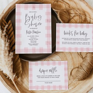 May include: Pink and white gingham baby shower invitation with the text "Join us for a baby shower in honor of Krista Hamson" and details about the event. There are also two additional cards with the text "books for baby" and "diaper raffle".