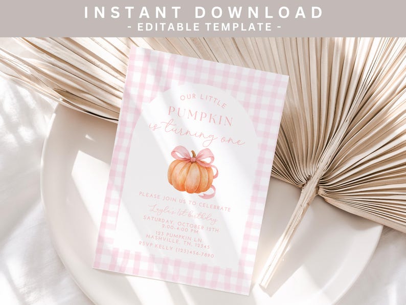 May include: A pink and white checked invitation card with the text "OUR LITTLE PUMPKIN is turning one." It features a watercolour pumpkin illustration with a pink bow. The card includes event details.