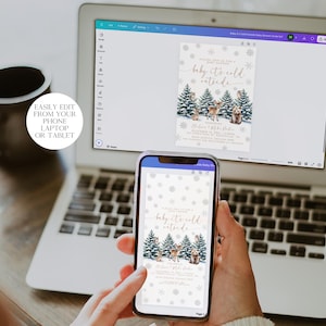 Puede incluir: Una pantalla de ordenador port&aacute;til que muestra una invitaci&oacute;n digital con un tema invernal. La invitaci&oacute;n presenta una ilustraci&oacute;n de acuarela de una escena de bosque con animales y el texto "baby it's cold outside".