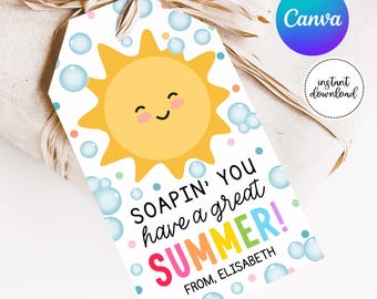 May include: A white gift tag with a yellow sun with a smiling face. The tag has colorful bubbles and confetti. The text on the tag reads "SOAPIN' YOU have a great SUMMER! FROM, ELISABETH".