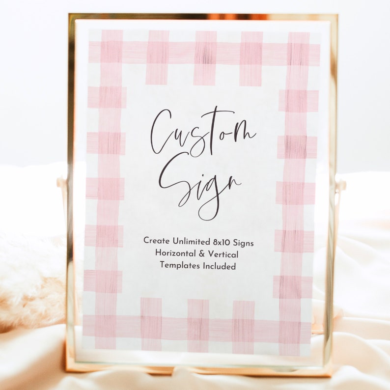 May include: A framed sign with a pink and white gingham pattern. The sign says "Custom Sign" and "Create Unlimited 8x10 Signs Horizontal & Vertical Templates Included".