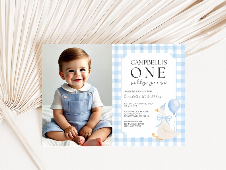 May include: A birthday invitation featuring a smiling baby in blue overalls next to a card with a blue gingham border. The card reads "Campbell is One" and includes event details and a goose illustration.