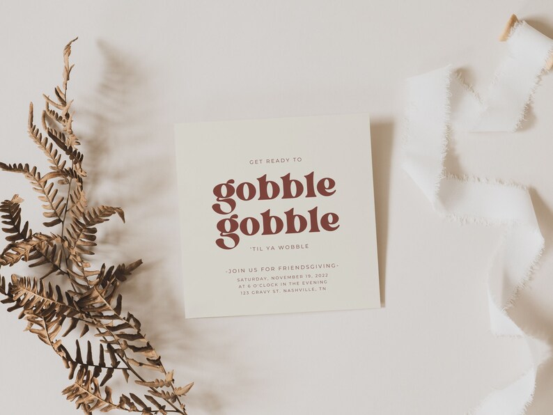 May include: A white card with brown text that reads "Get ready to gobble gobble 'til ya wobble."  The card also includes the text "Join us for Friendsgiving - Saturday, November 19, 2031 at 6 o'clock in the evening 123 Dravy St Nashville, TN."