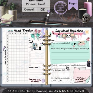 May include: A printable planner with a mood tracker and day mood reflection pages. The planner features decorative elements like bows, bats, and ghosts. The text includes "Reminder Planner Time!" and "Printable". The planner is designed for A4, A5, and 8.5 x 10 inch tablet sizes, and 21.59 x 27.94 cm.
