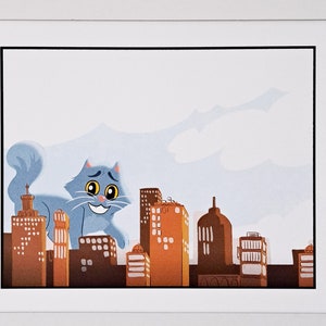 May include: A framed illustration of a blue cat standing on top of a city skyline. The cat has a surprised expression on its face. The buildings are all different heights and colors.