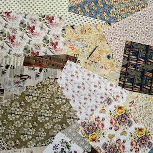 May include: A collection of patterned paper sheets in various designs. Floral patterns in pink, yellow, and purple are visible, along with botanical and vintage-style prints. Other patterns include dots, swirls, and a book-themed design. The papers are arranged in a collage.