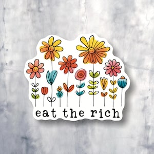 May include: A sticker with a colorful flower design and the text "eat the rich".