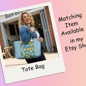 May include: A blue and white striped tote bag with a floral and lemon design. The bag has the initials "JMJ" on the front. The words "Tote Bag" are written at the bottom of the image.