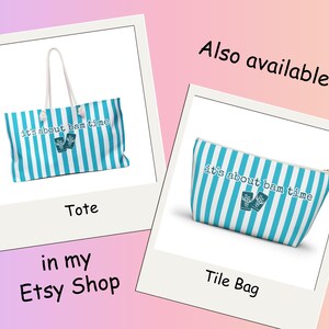 May include: A tote bag and a tile bag, both with a blue and white striped pattern. The bags have the text "it's about bam time" and a small graphic. The tote bag has white handles.