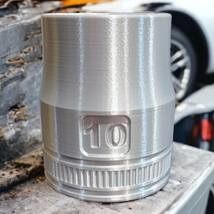 May include: A silver socket wrench with a 10mm size marked on it. The socket is made of metal and has a textured surface.
