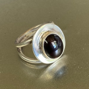 Deep red garnet sterling silver ring on heavy gauge bezel Boho Hippie Jewelry style, a protective and powerful talisman