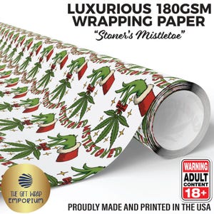 May include: White wrapping paper roll with a repeating pattern of green Grinch-like hands in red Santa-style sleeves, cannabis leaves, and the text "Stoner's Mistletoe." The paper is labeled "Luxurious 180GSM Wrapping Paper" and "Proudly Made and Printed in the USA."