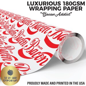 May include: A roll of luxurious white wrapping paper with a red "Bacon Addict" design. The paper features a repeating pattern of the word "Bacon" in a stylized font. The text "LUXURIOUS 180GSM WRAPPING PAPER" is at the top.