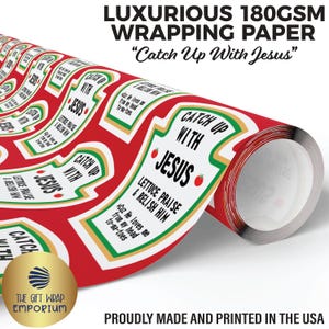 May include: A roll of luxurious wrapping paper with a red background and a repeating design of ketchup bottle labels. The labels read "Catch Up With Jesus" and include the text "Lettuce Praise & Relish Him". The paper is 180GSM.